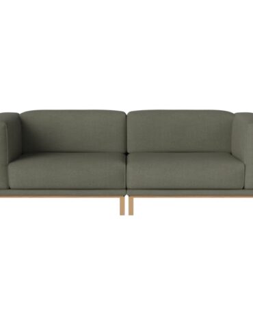 grünes Polstersofa mit Holzbeinen