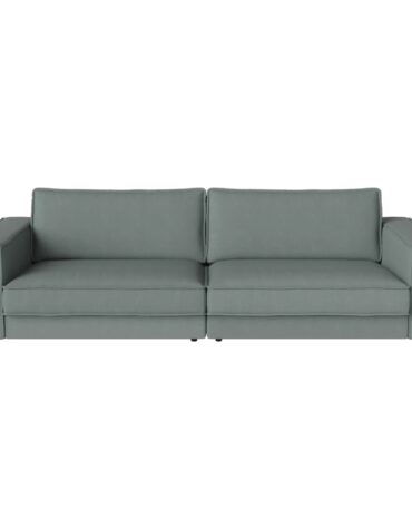 grünes Polstersofa mit Kissen