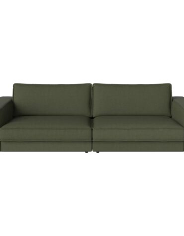 grünes Polstersofa mit Kissen